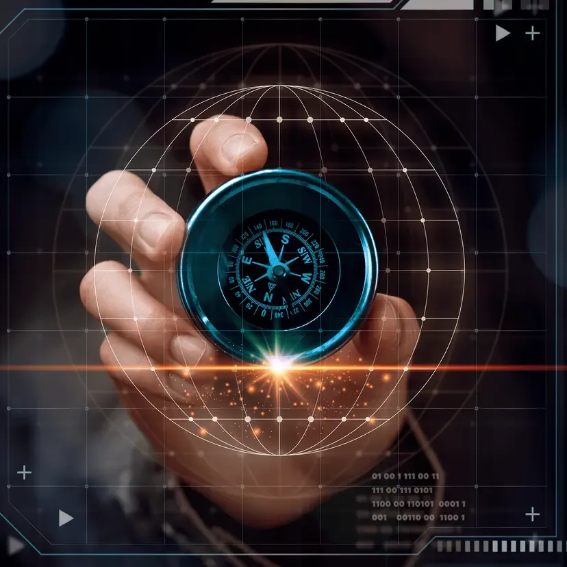 A human hand holds a glowing blue compass over a digital grid and globe.